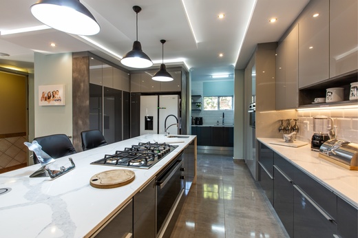 Renovated kitchen with granite tops and built-in cupboards